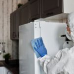 Disinfect - Person In A Protective Suit Disinfecting Inside The House